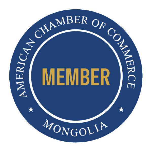 The round AmCham Mongolia member badge, in navy and gold